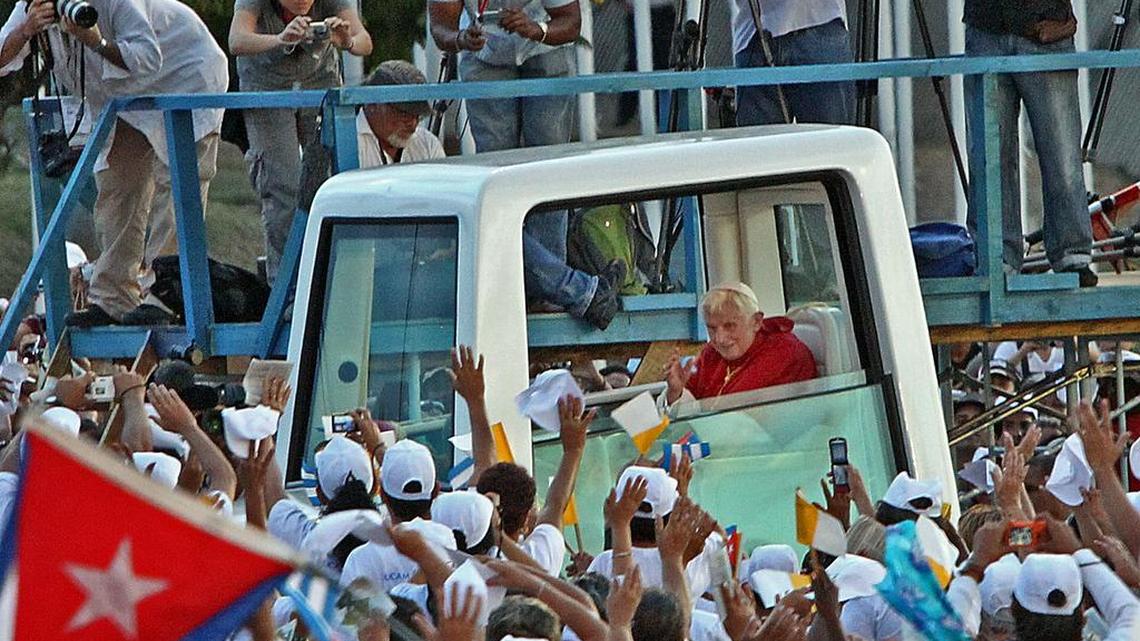 The crowd cheers as Pope Benedict arrives on Monday March 26, 2012 in the Plaza de la Revolucion Antonio Maceo in Santiago de Cuba.