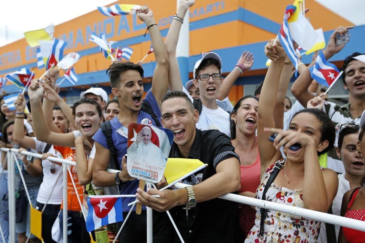 Cubans welcome Pope Francis as he arrives at Jose Marti International Airport in Havana.