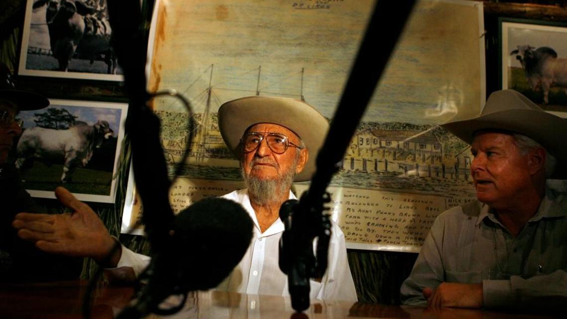 In this March 26, 2008, file photo, Ramón Castro, left, the elder brother of Cuba's Fidel Castro, speaks with journalists as cattleman John Parke Wright IV, of Florida, listens during the 13th Boyeros Cattleman's Fair in Havana, Cuba. Castro, a lifelong rancher and farmer, died Tuesday at age 91.