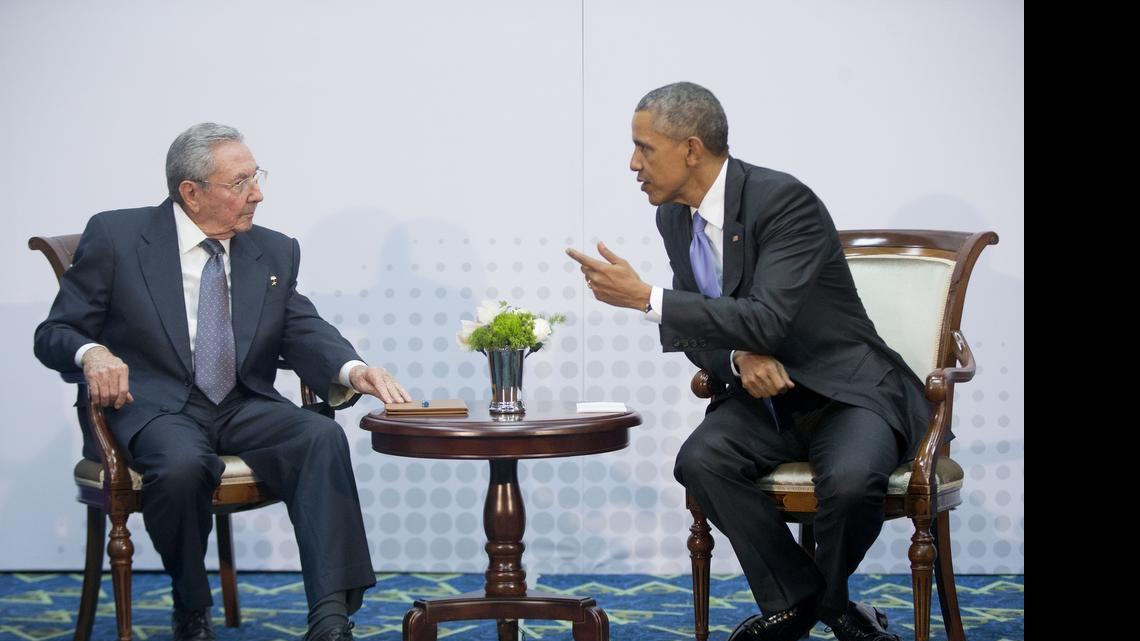 
US President Barack Obama, right, leans toward Cuban President Raul Castro during their meeting at the Summit of the Americas in Panama City, Panama, Saturday, April 11, 2015. The leaders of the United States and Cuba held their first formal meeting in more than half a century on Saturday, clearing the way for a normalization of relations that had seemed unthinkable to both Cubans and Americans for generations. 
