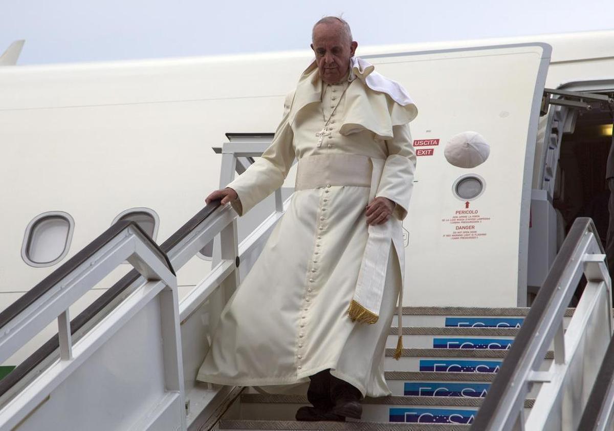 Pope Francis' cap flies off his head as he deplanes in Havana, Cuba, Saturday, Sept. 19, 2015. The pope began his 10-day trip to Cuba and the United States, embarking on his first trip to the onetime Cold War foes after helping to nudge forward their historic rapprochement. 