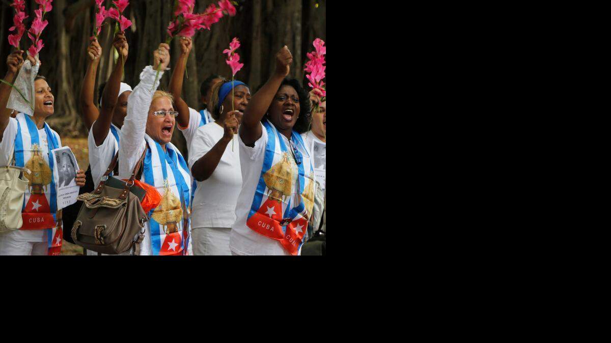 
Members of the Cuban dissident group Ladies in White participate in a demonstration in Havana, Cuba, on Sunday Dec. 28, 2014. The new U.S.-Cuba detente is already upending the civil society Obama hopes to strengthen. The prospect of engagement between the two former Cold War antagonists seems to be undercutting the island’s hard-line dissidents while boosting more moderate reformers who want to push President Raúl Castro gradually toward granting citizens more liberties.
