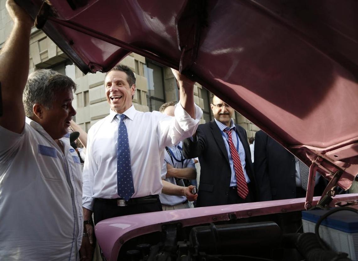 New York Gov. Andrew Cuomo smiles after seeing a Japanese Toyota engine fitted into the body of a 1956 Chevrolet in Havana. It’s one of the cars in the Nostalgicar fleet.