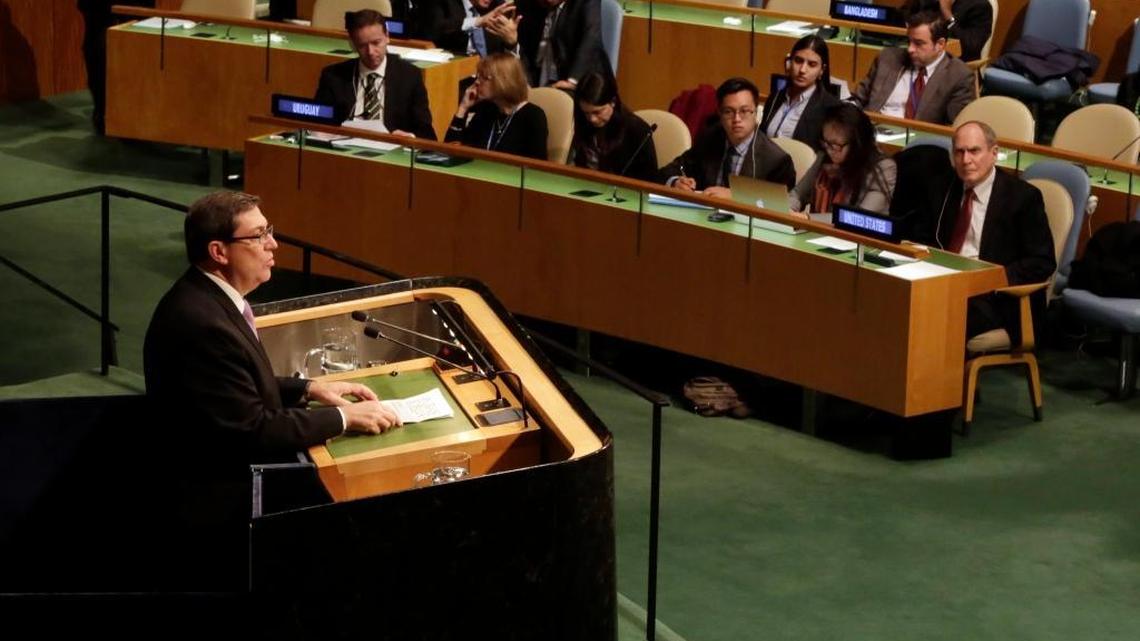 Cuba's Foreign Minister Bruno Rodriguez addresses the U.N. General Assembly, Tuesday, Oct. 27, 2015, as U.S. Ambassador Ronald Godard listens, at right.