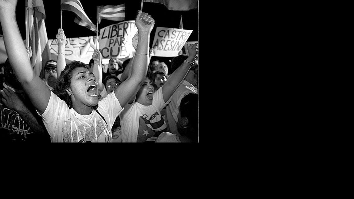 
Irma Roman joins hundreds of others protesting Feb. 25, 1996, against Cuba shooting down Brothers to the Rescue planes. The were outside the Brothers to the Rescue hangar at Opa-Locka Airport.
