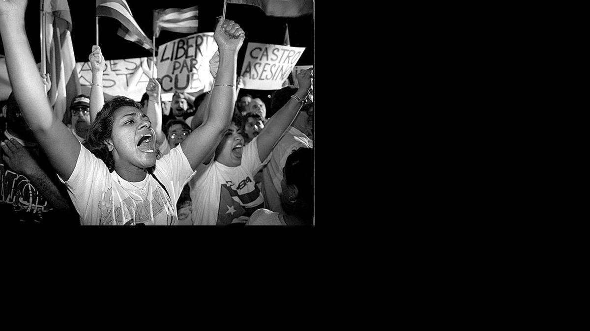 
Irma Roman joins hundreds of others protesting Feb. 25, 1996, against Cuba shooting down Brothers to the Rescue planes. The were outside the Brothers to the Rescue hangar at Opa-Locka Airport.
