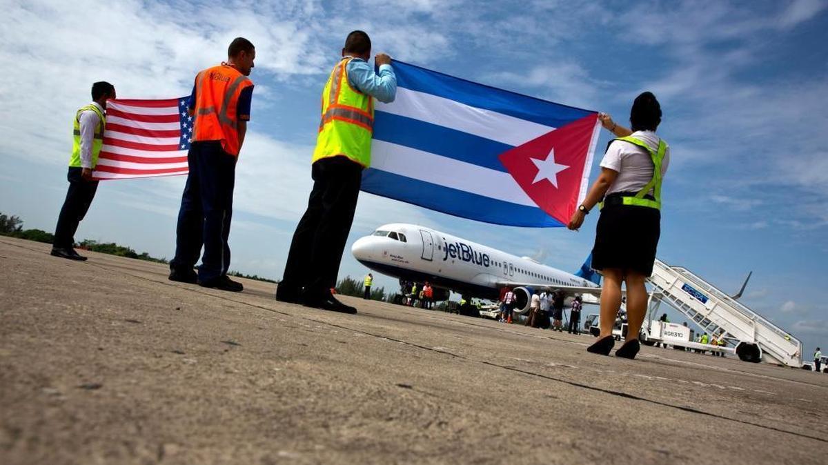 Airport workers receive JetBlue flight 387 on the airport tarmac in Santa Clara, Cuba. It was the first commercial flight between the U.S. and Cuba in more than a half century.