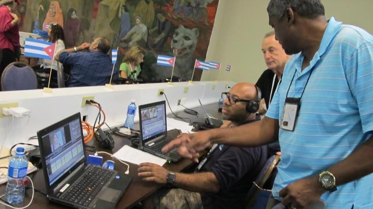 CBS4 assistant news director Nicholas Bourne works with photographer Joaquin Garcia and anchor Eliott Rodriguez to edit video in Havana.