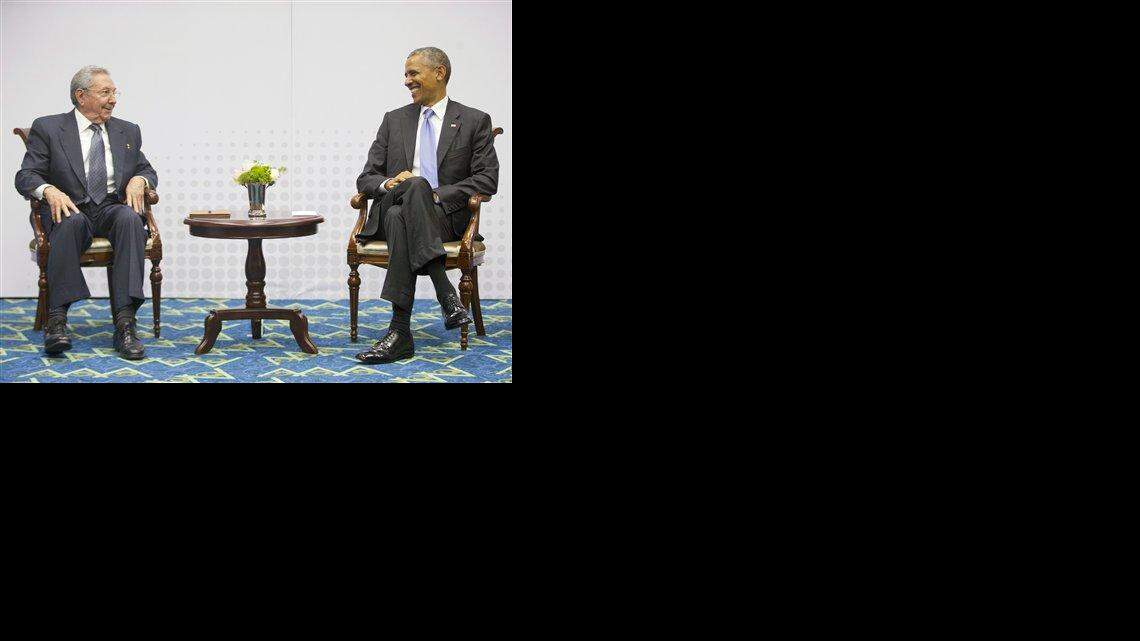 In this Saturday, April 11, 2015 photo, U.S. President Barack Obama, right, smiles as he looks over towards Cuban President Raul Castro, left, during their historic meeting, at the Summit of the Americas in Panama City, Panama. The leaders of the United States and Cuba held their first formal meeting in more than half a century on Saturday, clearing the way for a normalization of relations that had seemed unthinkable to both Cubans and Americans for generations.