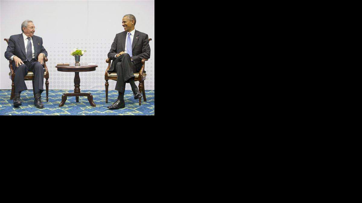 In this Saturday, April 11, 2015 photo, U.S. President Barack Obama, right, smiles as he looks over towards Cuban President Raul Castro, left, during their historic meeting, at the Summit of the Americas in Panama City, Panama. The leaders of the United States and Cuba held their first formal meeting in more than half a century on Saturday, clearing the way for a normalization of relations that had seemed unthinkable to both Cubans and Americans for generations.