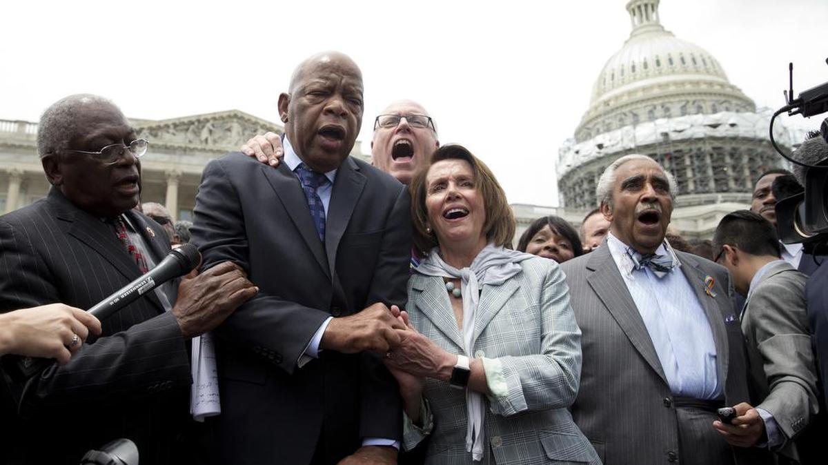 From left, House Assistant Minority Leader James Clyburn of S.C., Rep. John Lewis, D-Ga., Rep. Joseph Crowley, D-N.Y., House Minority Leader Nancy Pelosi of Calif. and Rep. Charles Rangel, D-N.Y., sing "We Shall Overcome" on Capitol Hill in Washington, Thursday, June 23, 2016, after House Democrats ended their sit-in protest.