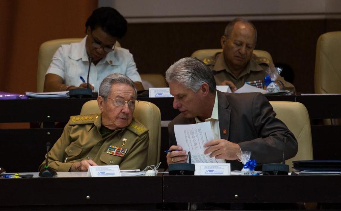 Cuban President Raul Castro, front left, speaks with his first vice-president Miguel Diaz-Canel during a session of the National Assembly in Havana onThursday. The National Assembly has extended its term by two months, until April 2018, a signal that Castro will remain in the presidency longer than expected.