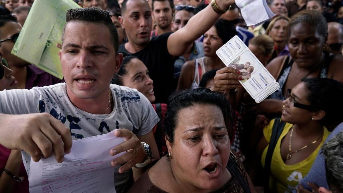Cubans gather outside Ecuador's embassy in Havana, expressing frustration at a new rule that now requires a visa to visit the South American country. The lack of a visa requirement for Cubans made Ecuador a favored destination for those seeking to leave the island and make the overland route to the United States, where they can receive automatic legal residency.