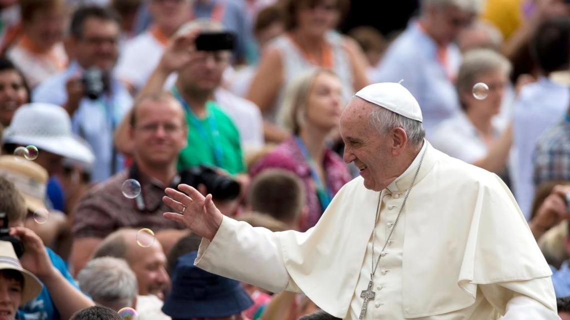 
Soap bubbles fly as Pope Francis arrives for his weekly general audience in St. Peter's Square at the Vatican, Wednesday, Sept. 2, 2015.
