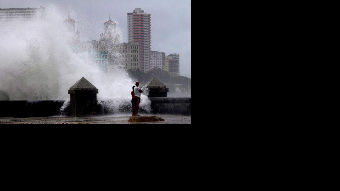 
Waves pound the boardwalk, the Malecon, during the passing of Tropical Storm Isaac in Havana Cuba, Sunday, Aug. 26, 2012. The hurricane center said the storm, which was swirling north of the central coast of Cuba in the pre-dawn hours, was expected to be near or over the Florida Keys sometime later Sunday or Sunday night. 
