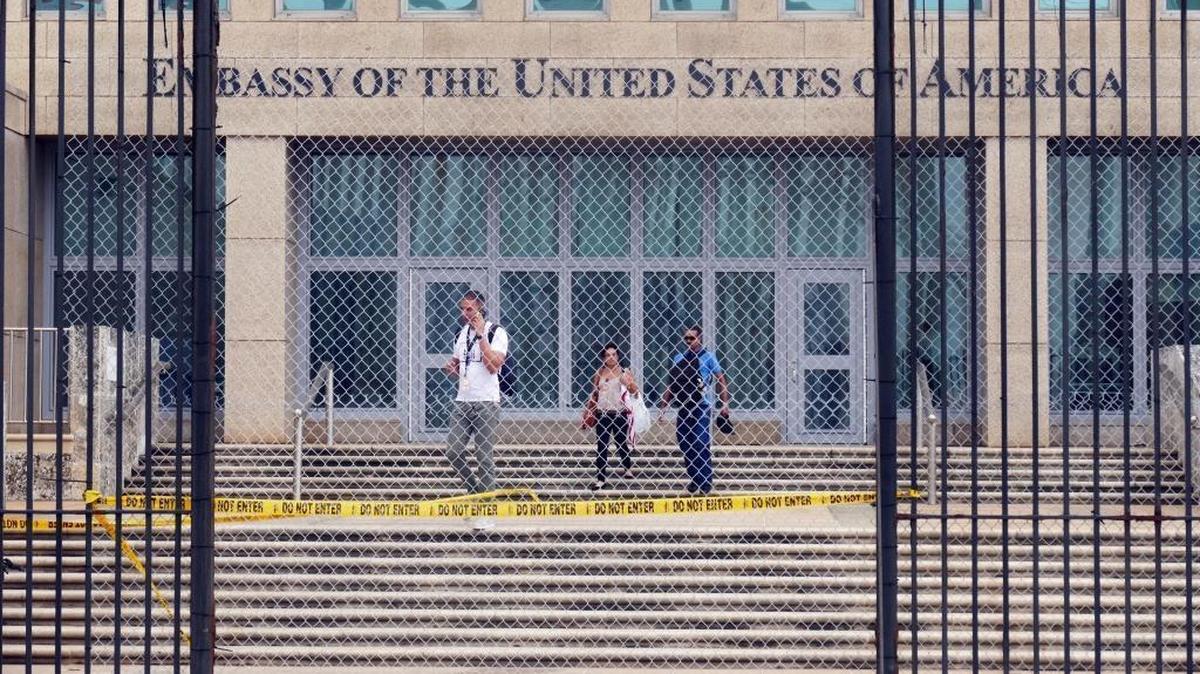 Workers at the U.S. Embassy in Havana leave the building on Sept. 29, 2017, after the State Department announced that it was withdrawing all but essential personnel from the embassy because Cuba could no longer guarantee diplomats’ safety.