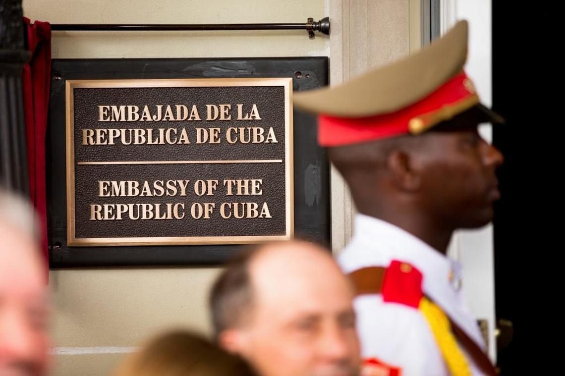 A member of the Cuban honor guard stands next to a new plaque at the front door of the newly reopened Cuban embassy in Washington in July 2015. After unexplained health incidents affecting U.S. Embassy personnel in Havana, the U.S. expelled 15 Cuban diplomats from the Washington embassy.