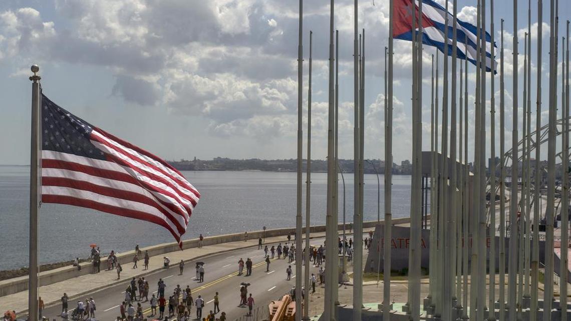 The U.S. and Cuban flags wave outside the U.S. Embassy in Havana.