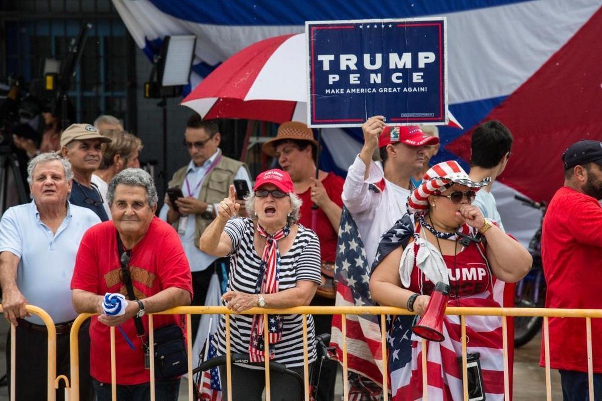 Supporters of Donald Trump yell at an opposite group on Flagler Steet during president Trump’s visit to Miami on Friday, June 16, 2017.
