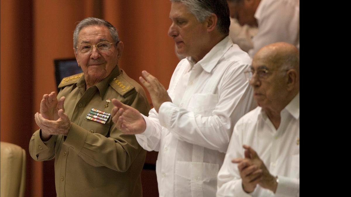 
Cuba's President Raul Castro, left, applauds alongside Vice President Miguel Diaz-Canel, center, and Vice President Jose Ramon Machado Ventura during a National Assembly session in Havana on July 15, 2015. 

