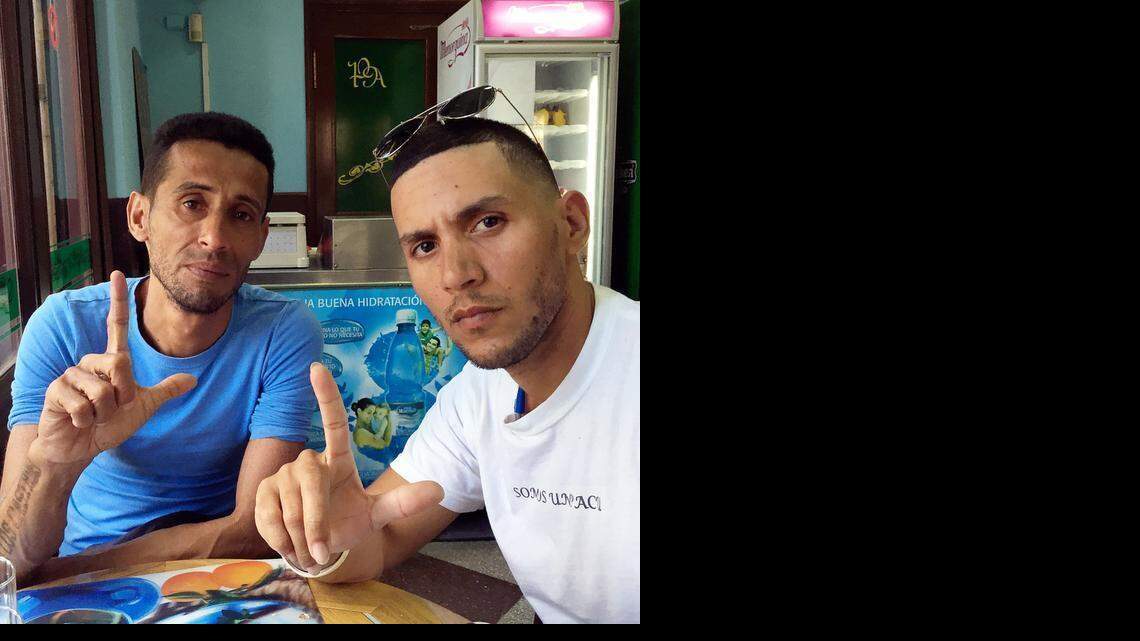 
Cuban rapper Ángel Yunier Remón Arzuaga, aka 'El Critico', right, during an interview. The man to the left is also a rapper.
