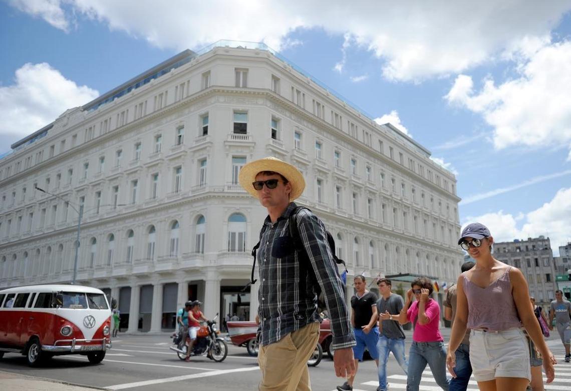 Tourists walk near the Gran Hotel Manzana Kempinski in Havana. The Swiss hotel company Kempinski operates the hotel under a contract with the Gaviota group, which is owned by the Cuban military. Rules are being written that would bar American travelers and companies from any direct transactions with the Cuban military.