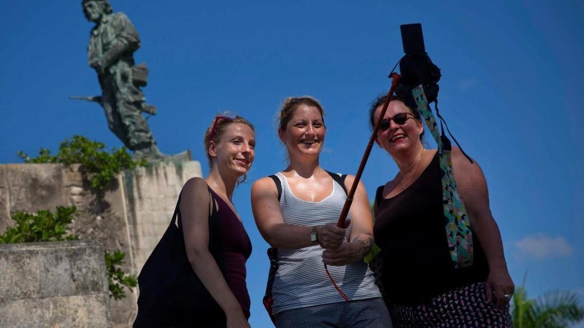 Tourists takes a selfie by the statue of revolutionary hero Ernesto “Che”Guevara in Santa Clara, Cuba. American travelers have begun to explore destinations outside Havana.