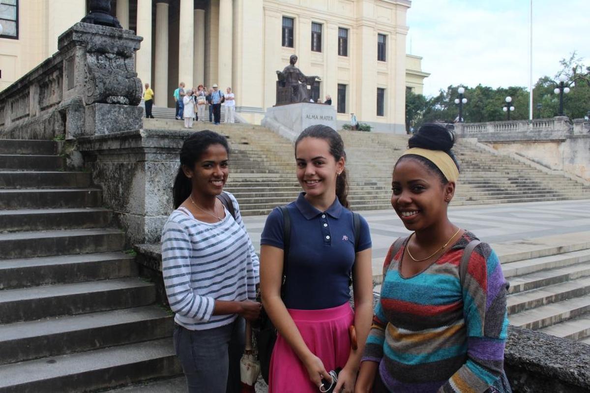 Laura de Leon, left, with two of her buddies from the freshman class of pharmacy students at the University of Havana. De Leon doesn’t agree with a popular perception that young people in Cuba are apolitical and more interested in trying to figure out how to leave than planning for a future on the island.
