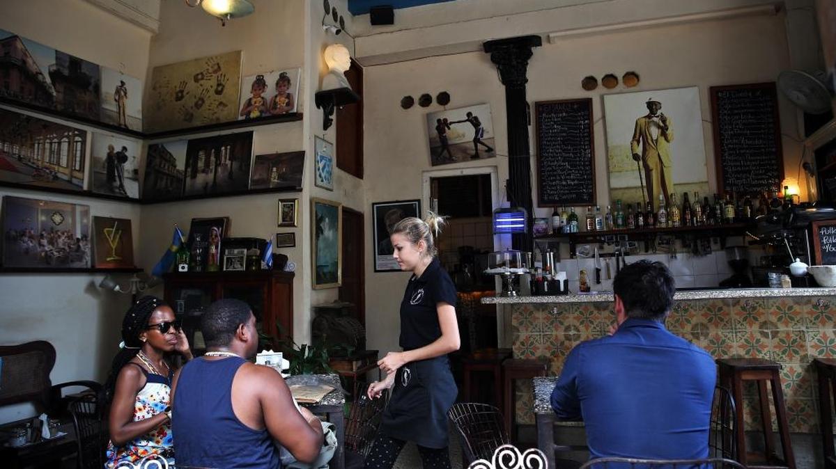 Customers are served at a private café in Havana. This week the Cuban government announced it has stopped issuing licenses for some of the more lucrative private businesses on the island, such as private restaurants and B&Bs.