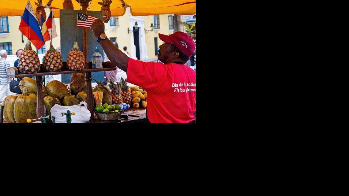 
A private fruit vendor decorates his stand with a U.S. flag in Havana.
