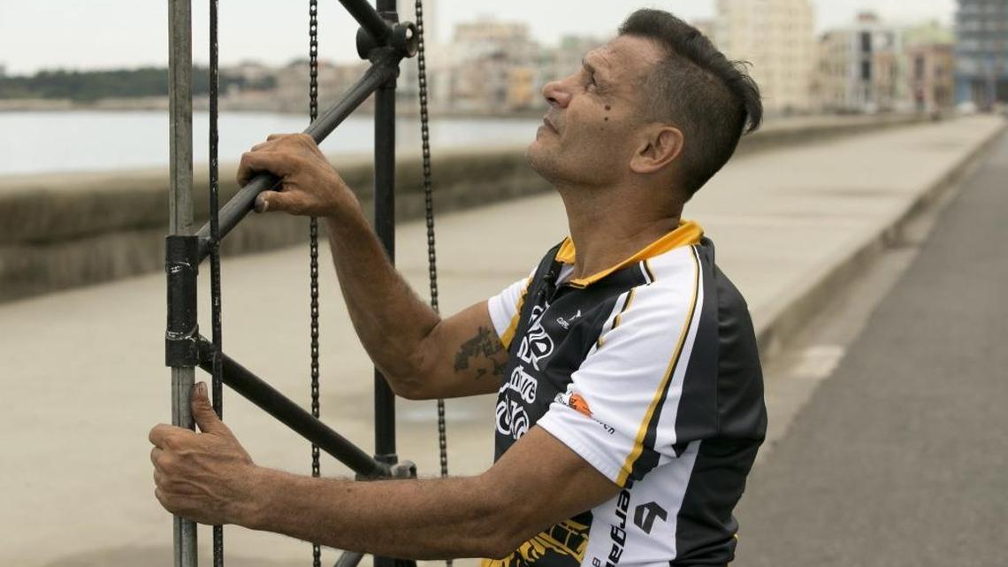 Félix Ramón Guirola Cepero rides multi-frame tall bikes through Havana. He’s shown here on Sept 24, 2015, before he clambers up his towering bike. His recent attempt to set a Guinness world record fell short.