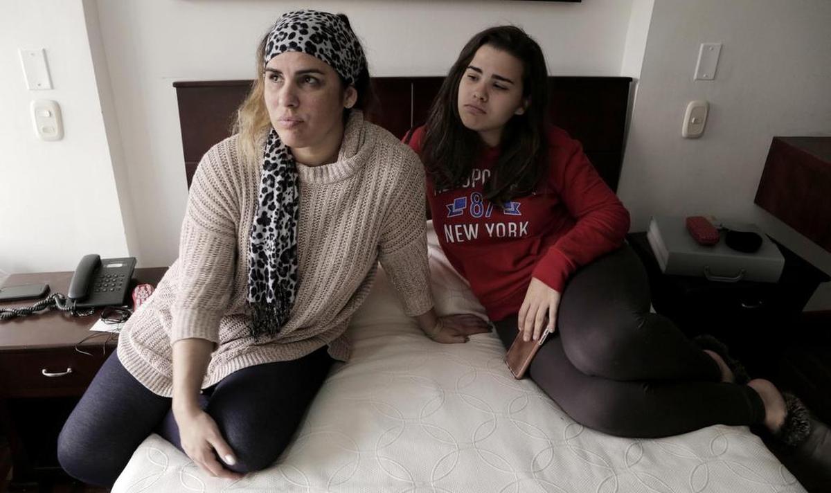 Lisset López Rodríguez (left) and her daughter Camila Guzmán López in their tiny hotel room in Bogota, Colombia as they wait for an interview date at the U.S. Embassy in Bogota. Since the reduction of staff at the U.S. Embassy in Havana because of health attacks against diplomats, Cubans that were in the process of getting permanent visas for their family members to travel to the United States now have to go to Bogota, Colombia to complete the process.