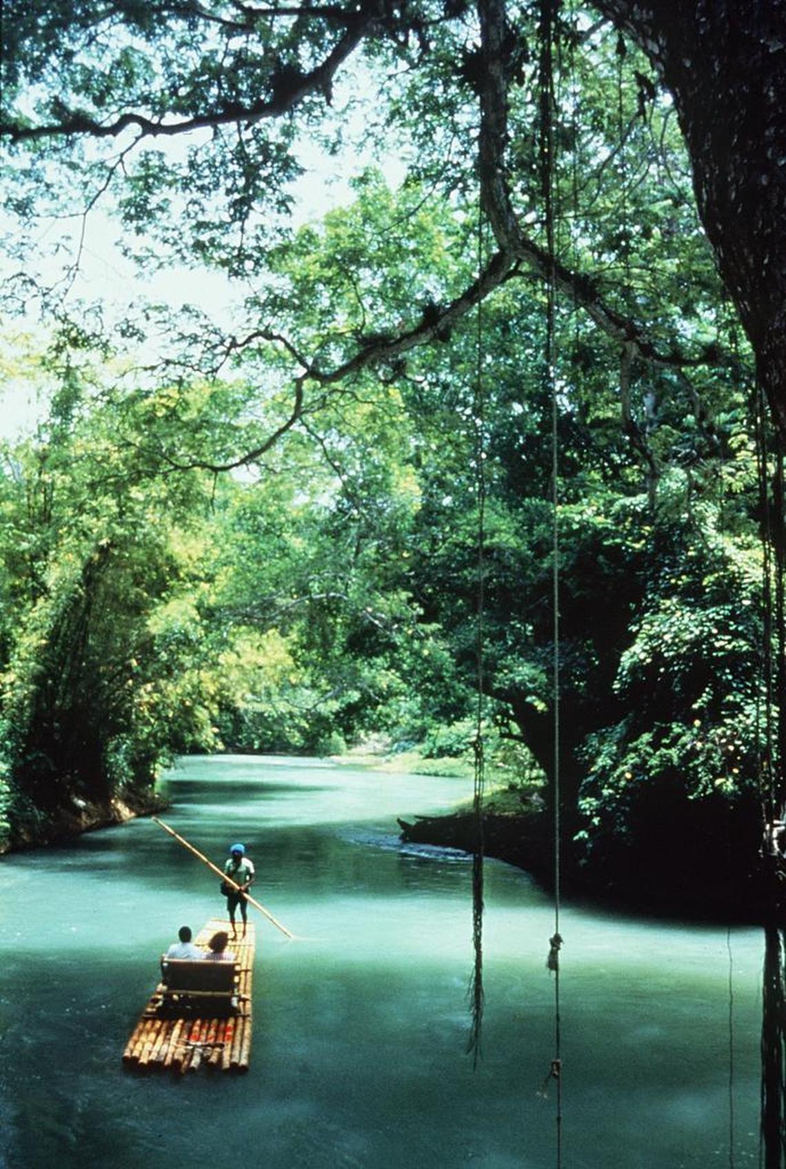 Could an increase in international visitors to Cuba also boost interest in travel to Jamaica? Tourists are shown rafting on Jamaica’s Martha Brae.
