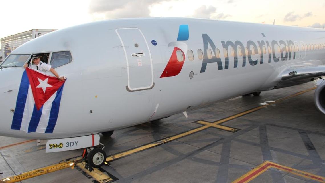 American Airlines Chief Pilot Kevin Mase holds a Cuban flag on Dec. 16, 2015, the day the United States and Cuba reached an agreement to restore regularly scheduled flights between the two countries.