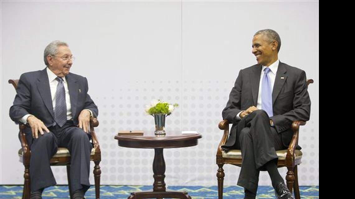 In this Saturday, April 11, 2015 photo, U.S. President Barack Obama, right, smiles as he looks over towards Cuban President Raul Castro, left, during their historic meeting, at the Summit of the Americas in Panama City, Panama. The leaders of the United States and Cuba held their first formal meeting in more than half a century on Saturday, clearing the way for a normalization of relations that had seemed unthinkable to both Cubans and Americans for generations.