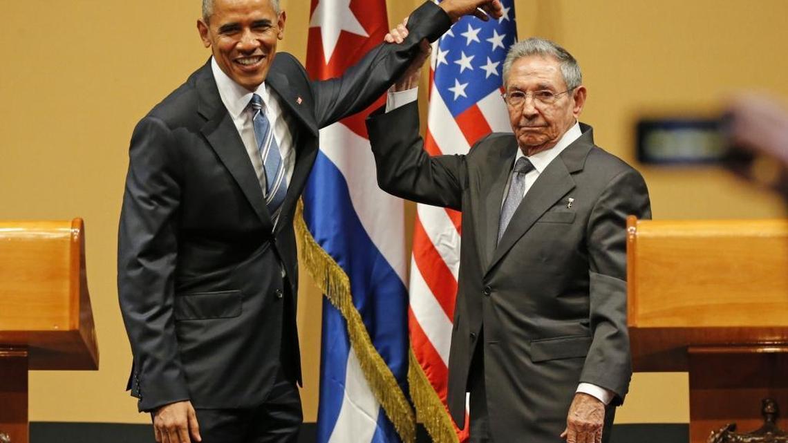Cuban leader Raúl Castro lifts President Barack Obama’s arm after a joint news conference in Havana in March.