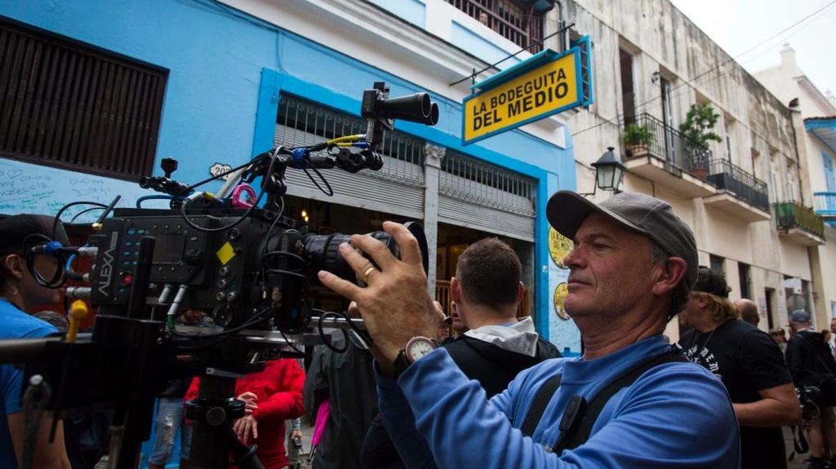In this Jan. 15, 2016 photo, “House of Lies” camera assistant Michael Endler prepares for a shoot outside the Bodeguita Del Medio bar, in Havana, Cuba.