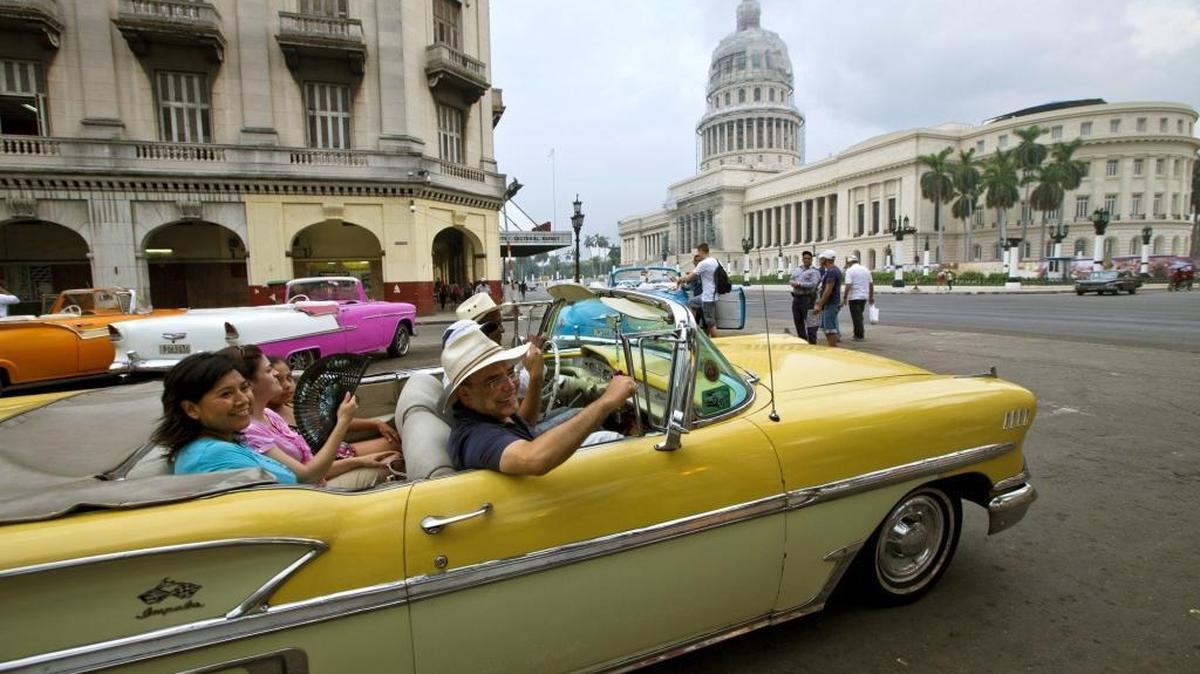 Mexican tourists tour Old Havana in a 1958 convertible Chevy Impala in Cuba on Thursday, September 24, 2015. In the past year, Cuba has welcomed a record number of international visitors, including those from the United States.