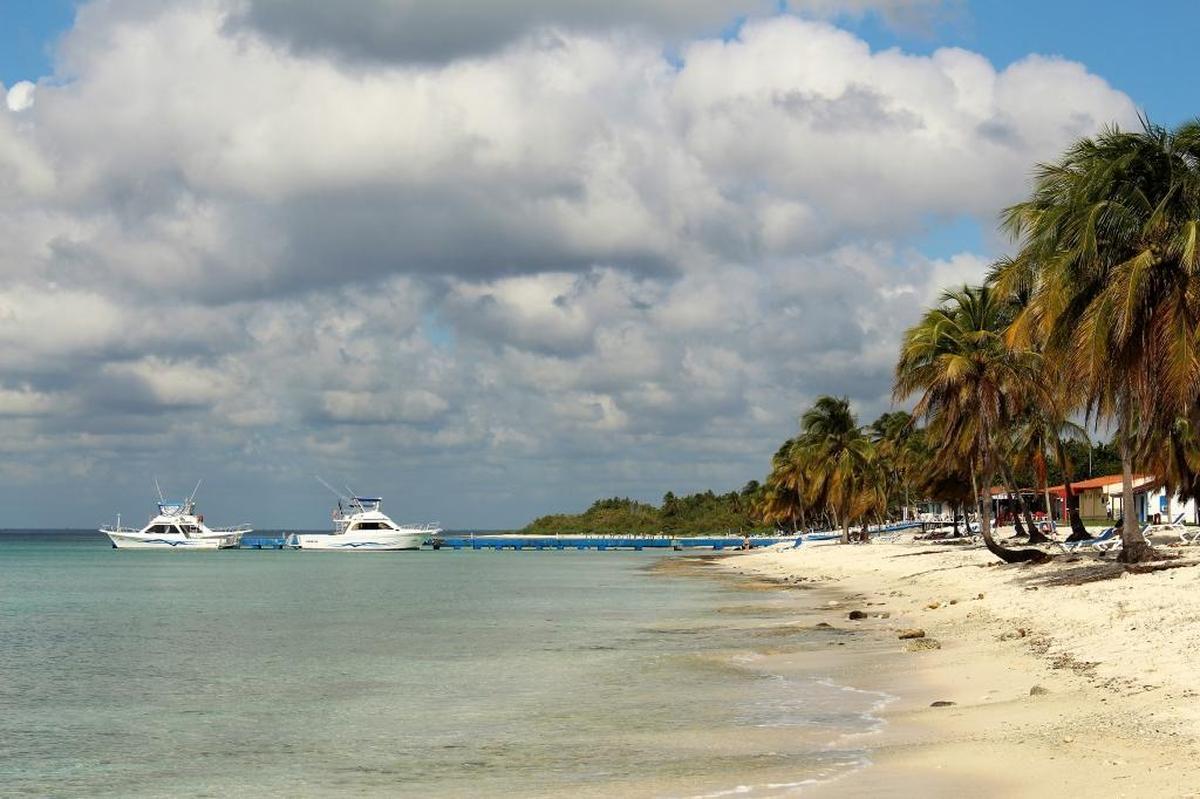 Government tourism boats await visitors at Maria la Gorda in western Cuba. In the first six months of the year, 2.67 million international travelers visited the island.