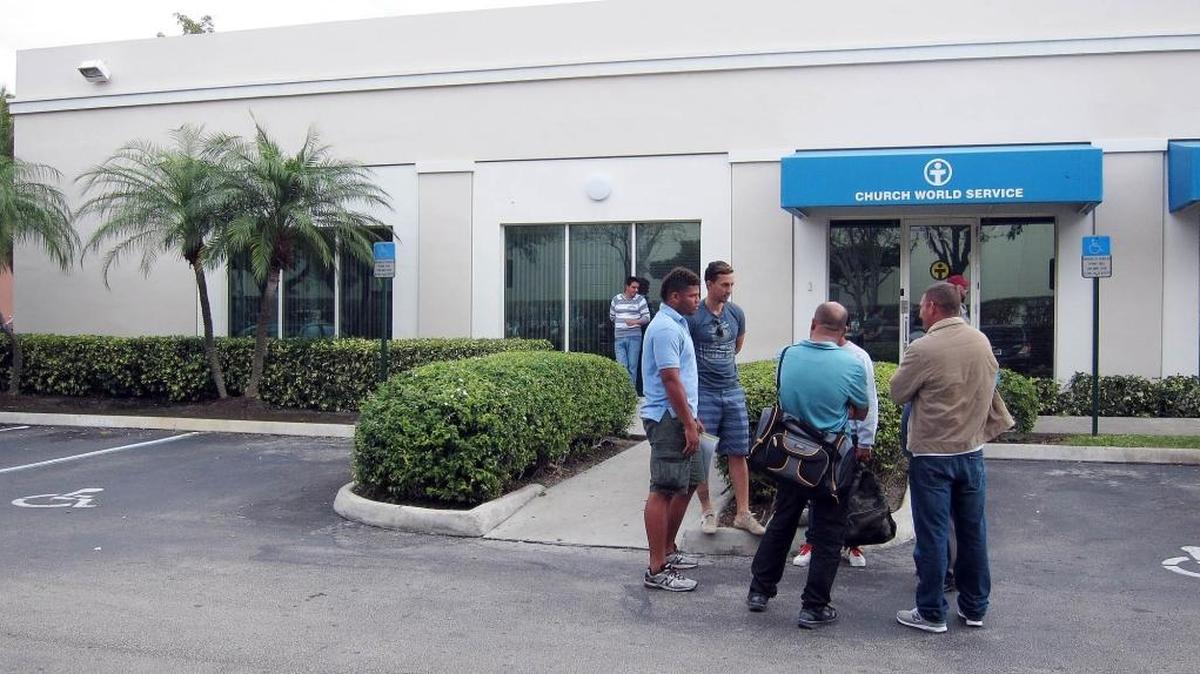 File photo from 2015 of a small group of Cubans at Church World Service offices in Doral.