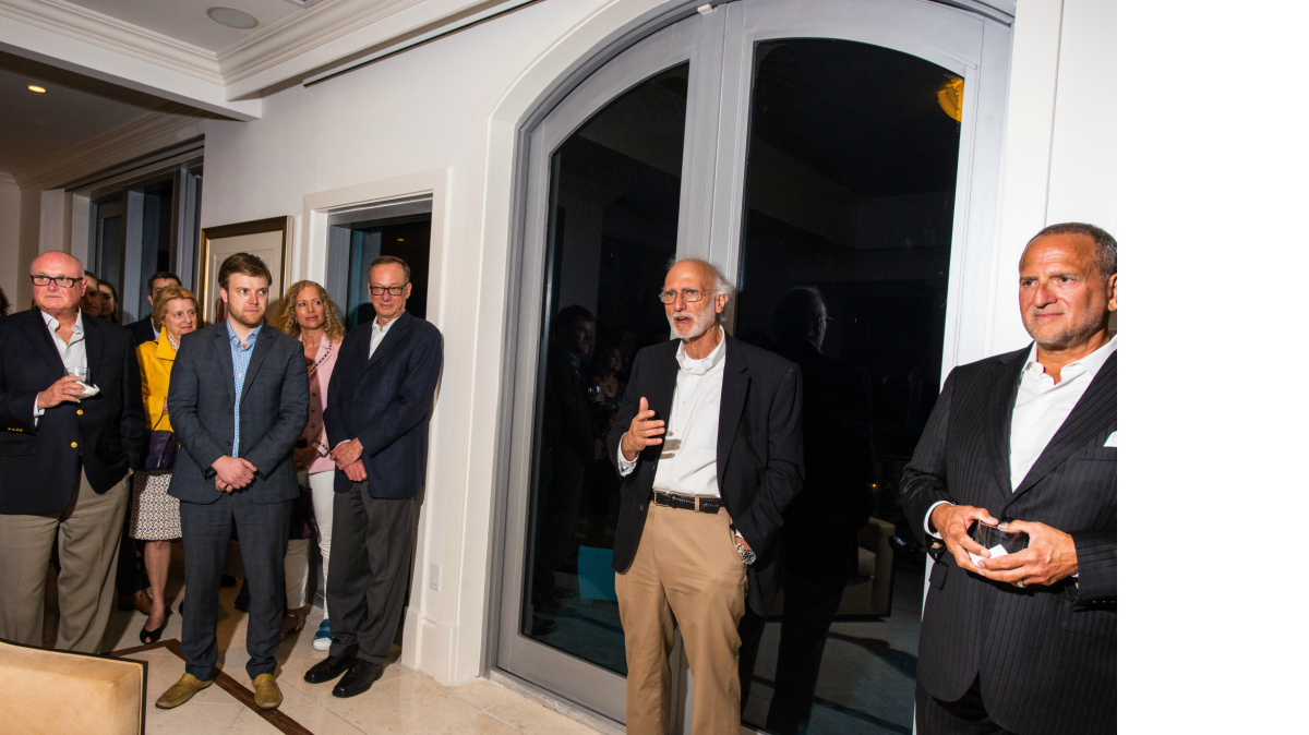 
Alan Gross speaks during a fundraiser for the newly formed New Cuba PAC at the Miami Beach home of Scott Gilbert (far right) on May 4, 2015.
