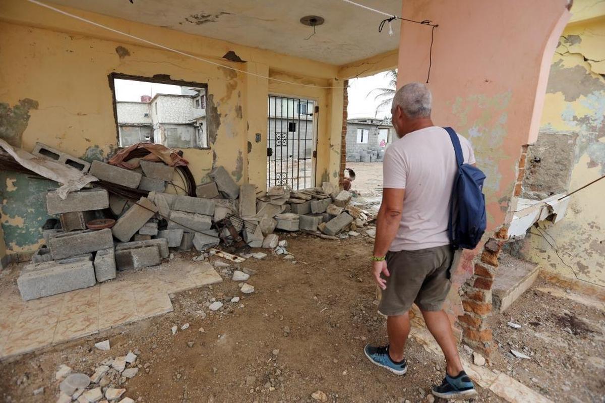 This Cojímar, Cuba, home belonging to Juan Carlos Cordero, has only two walls left standing and a staircase to nowhere. Cordero visited the home to collect bricks and other supplies to begin the rebuilding process.