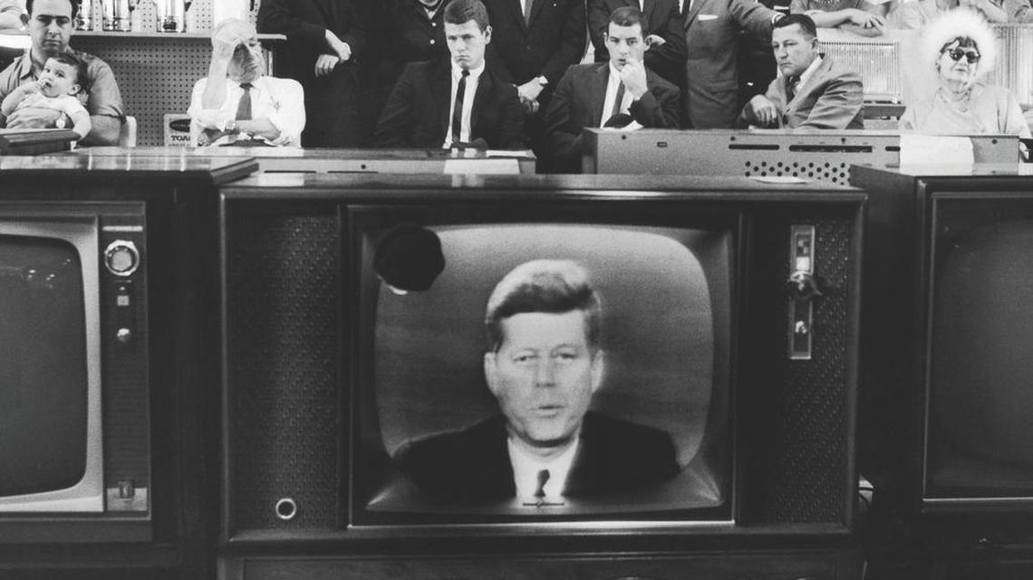 High-alert: People in a department store watch President John F. Kennedy’s TV announcement of Cuban blockade during the 1962 Cuban Missile Crisis.