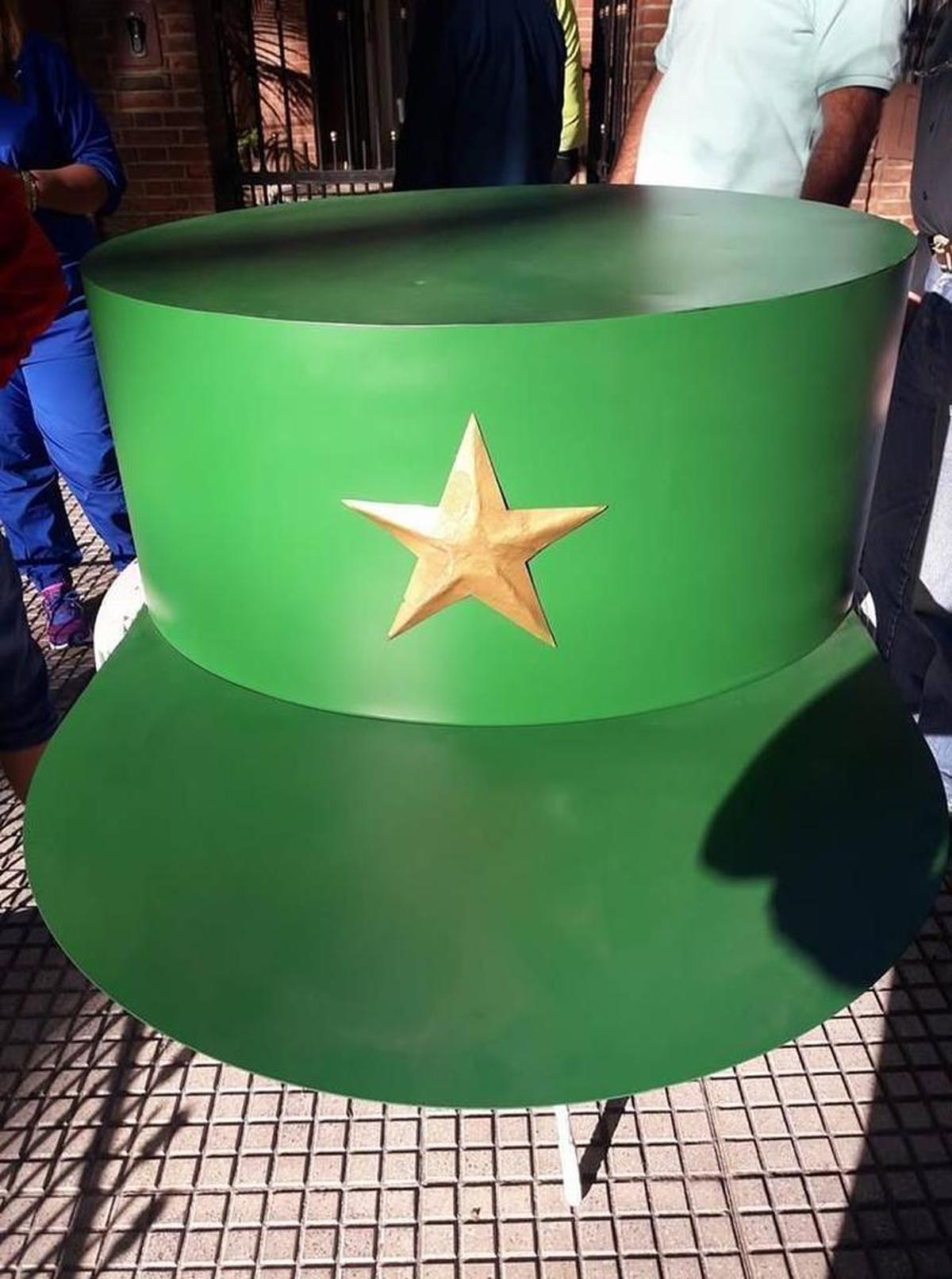 A giant metal cap like the one Fidel Castro used to wear was fabricated by Argentine workers.