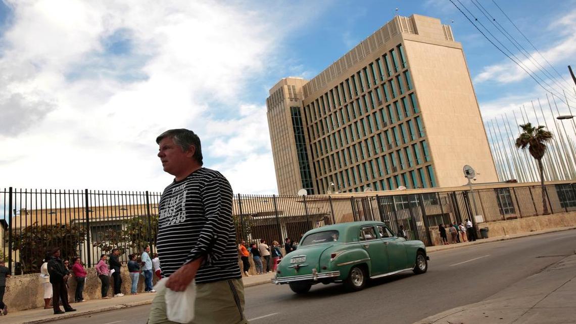 
Cubans line up at the United States Interests Section in Havana, to apply for visas to go the the United States on Jan. 30, 2015. The U.S. flag is not flown outside the building but that changes this week when the U.S. reopens its embassy and diplomatic relations are restored. 
