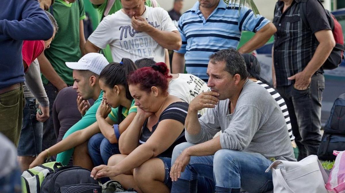 File photo of a group of Cubans who wait to be treated outside the National Institute of Migration of Mexico after crossing the River Suchate, that was part of the route of the Cubans headed to towards the U.S.