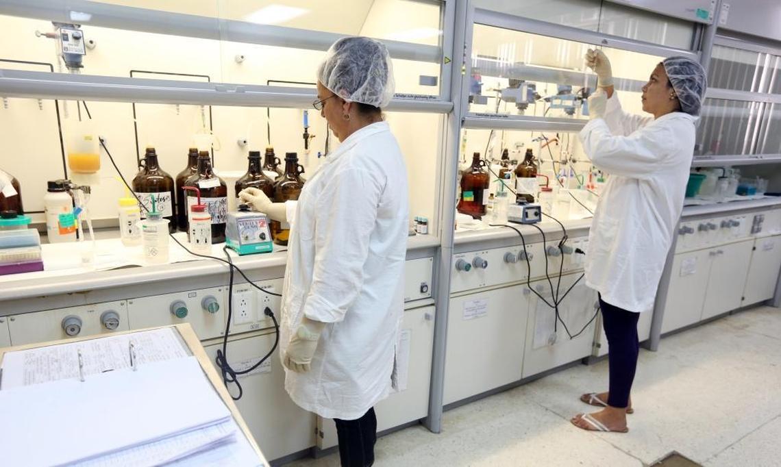 Cecilia Sagardoy and Yordanka Mascorrol, peptide scientists, work inside a chemical lab at the Center for Genetic Engineering and Biotechnology in Havana, Cuba.