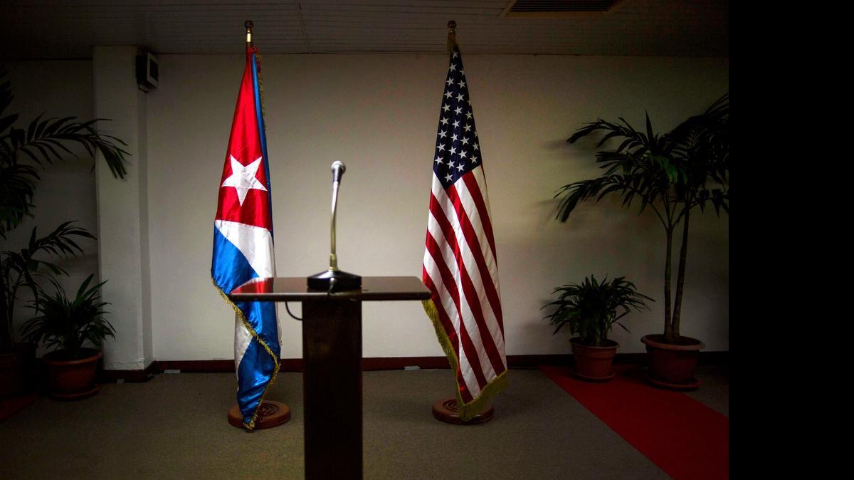 
The United States and Cuba reestablished diplomatic relations early on July, 20, 2015. In this Jan. 22, 2015 file photo, a Cuban and U.S. flag stand before the start of a press conference on the sidelines of talks between the two nations in Havana.
