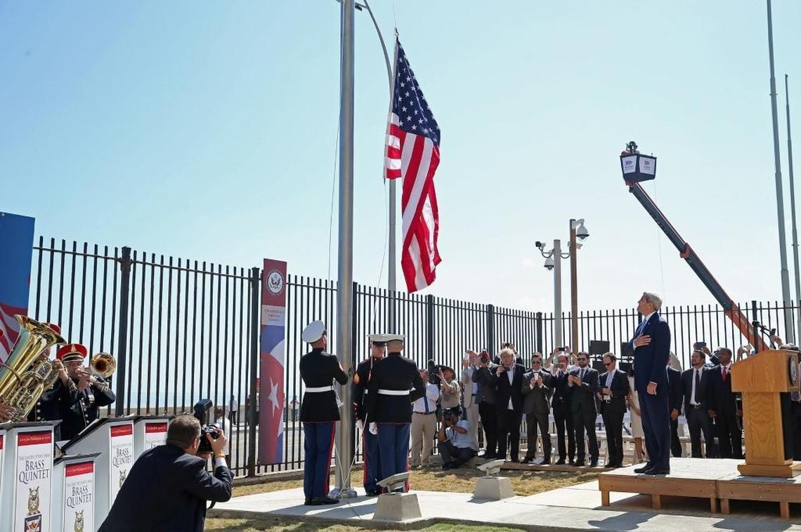 Secretary of State John Kerry, right, watches as Marines raise the American flag at the U.S. Embassy in Havana on August 14, 2015 in Havana, Cuba. Kerry was the first American secretary of state to visit Cuba since 1945.
