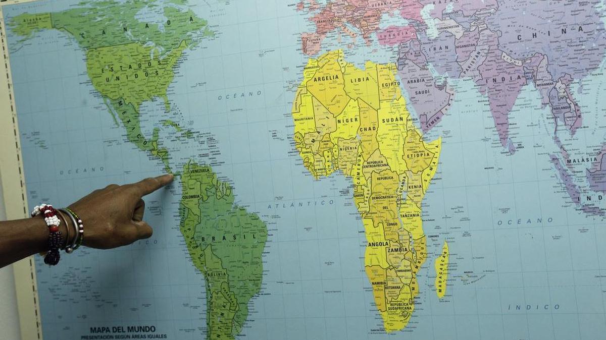 A Cuban migrant points out his route to the U.S. File photo.